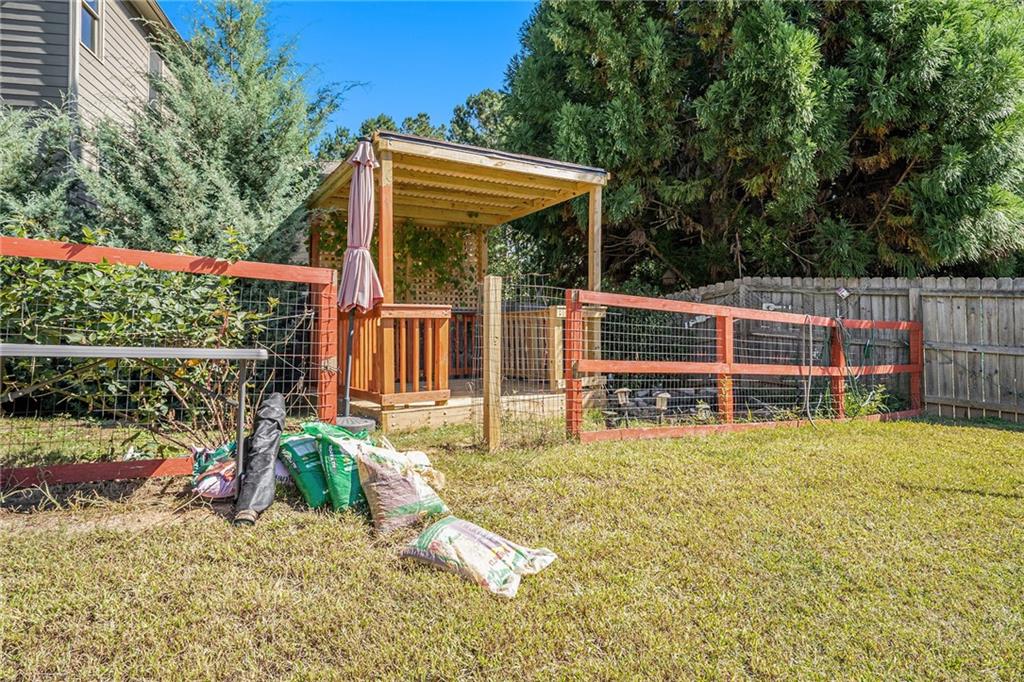 115 Floating Leaf Way Dallas, GA 30132 - Photo 45 of 47 a view of small yard in front of house with wooden fence