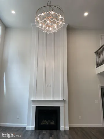 a view of a livingroom with a chandelier fan