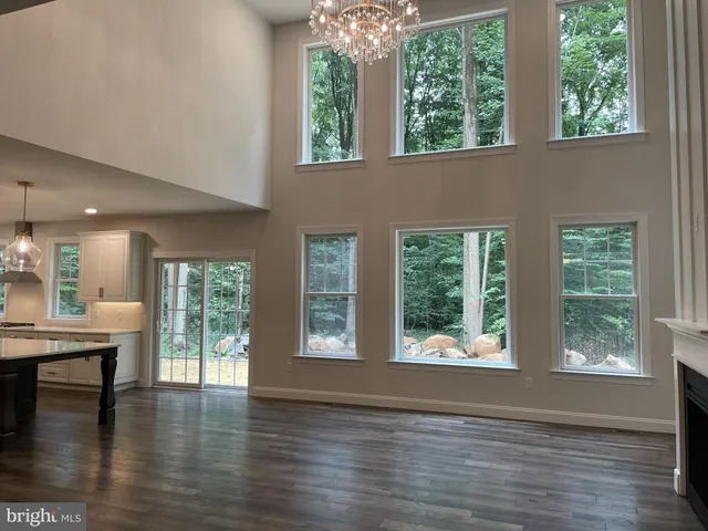 a view of an entryway with wooden floor and windows