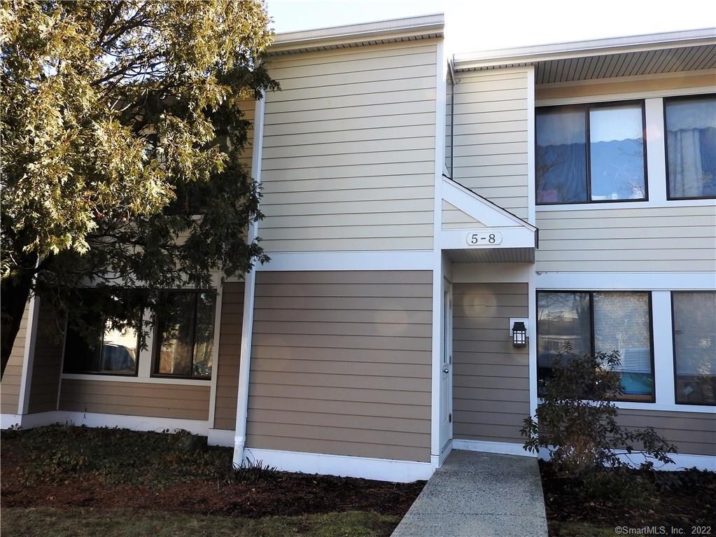 8 Quincy Close, Unit 8 Ridgefield, CT 06877 - Photo 1 of 1 a view of a house with a yard