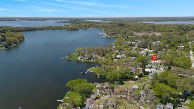 an aerial view of a houses with ocean view