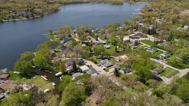 an aerial view of a residential houses with outdoor space