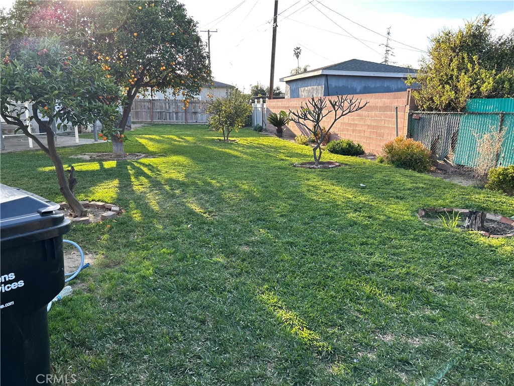 7847 Blandwood Road Downey, CA 90240 - Photo 3 of 4 a view of a house with a yard and sitting area