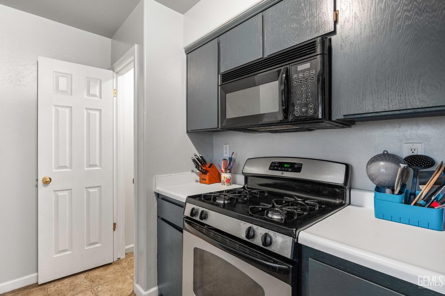 Undisclosed Address Arvin, CA 93203 - Photo 11 of 33 a kitchen with a stove and a microwave