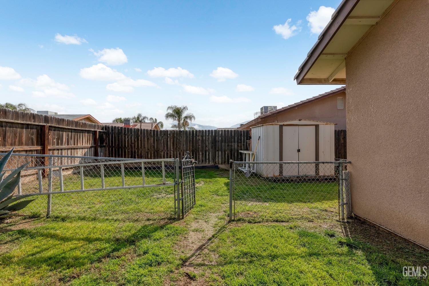 Undisclosed Address Arvin, CA 93203 - Photo 30 of 33 a view of a backyard with a garden and entertaining space