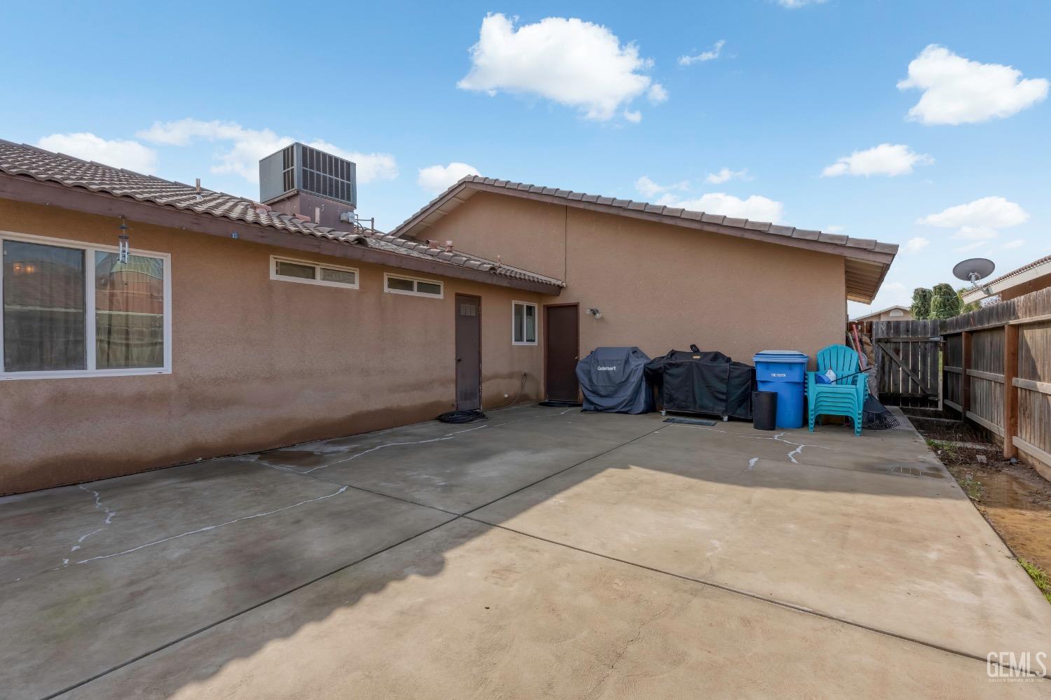 Undisclosed Address Arvin, CA 93203 - Photo 31 of 33 a front view of a house with a yard and garage