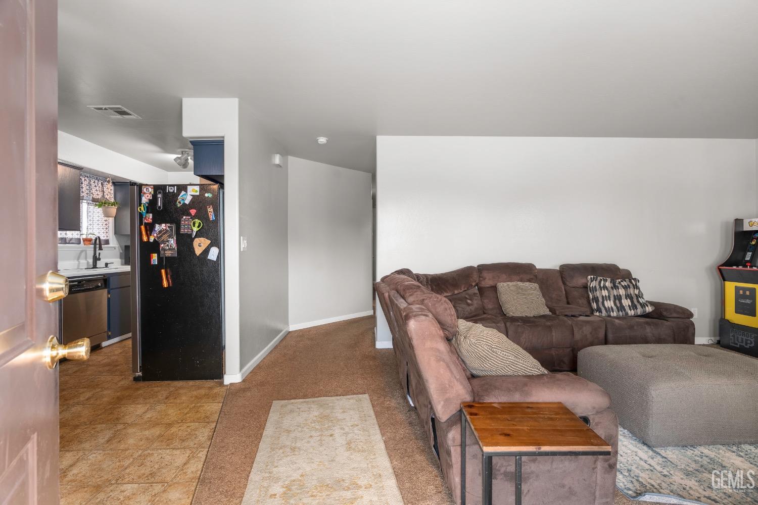 Undisclosed Address Arvin, CA 93203 - Photo 6 of 33 a living room with furniture and a couch