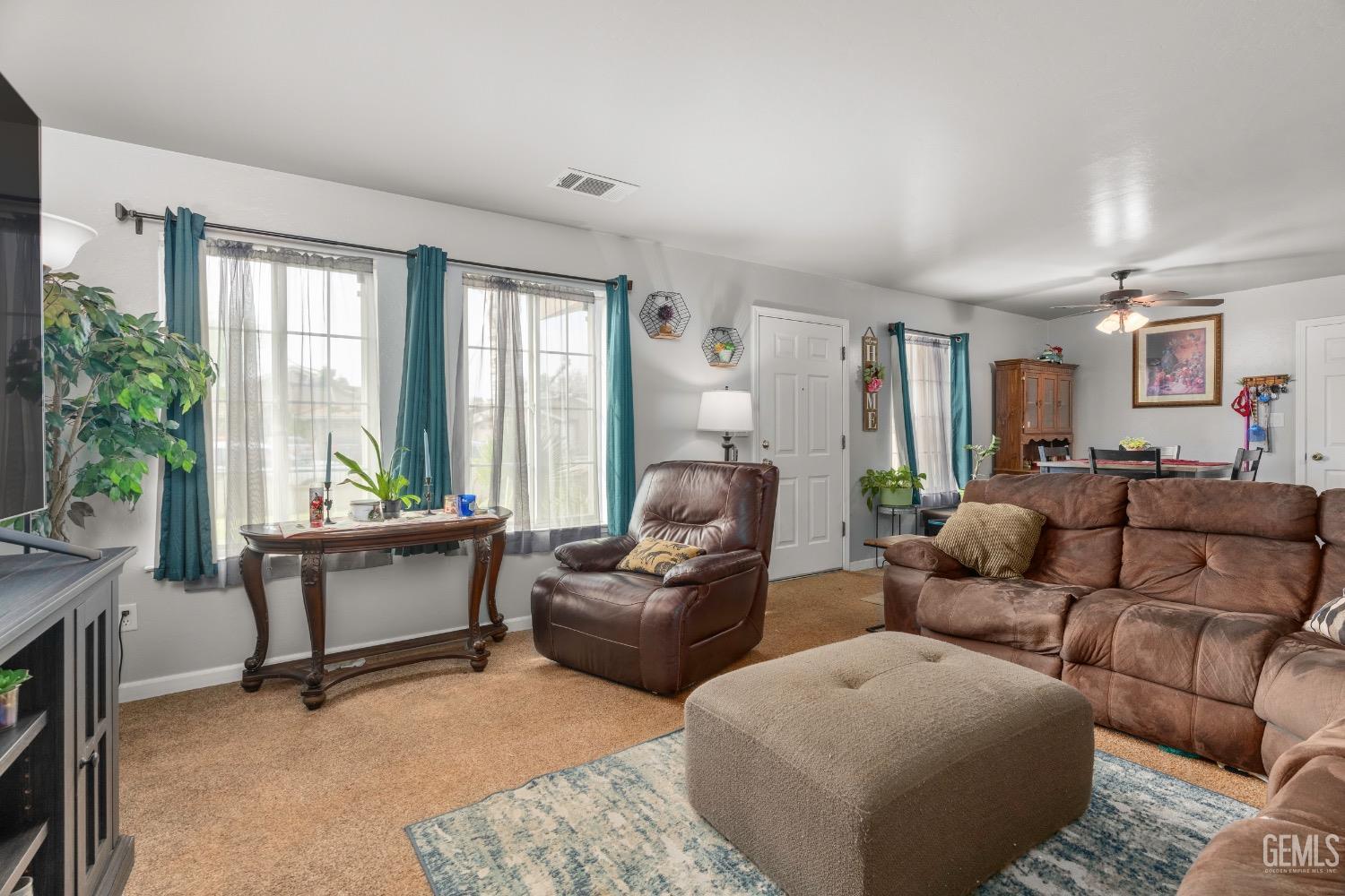 Undisclosed Address Arvin, CA 93203 - Photo 8 of 33 a living room with furniture and a large window