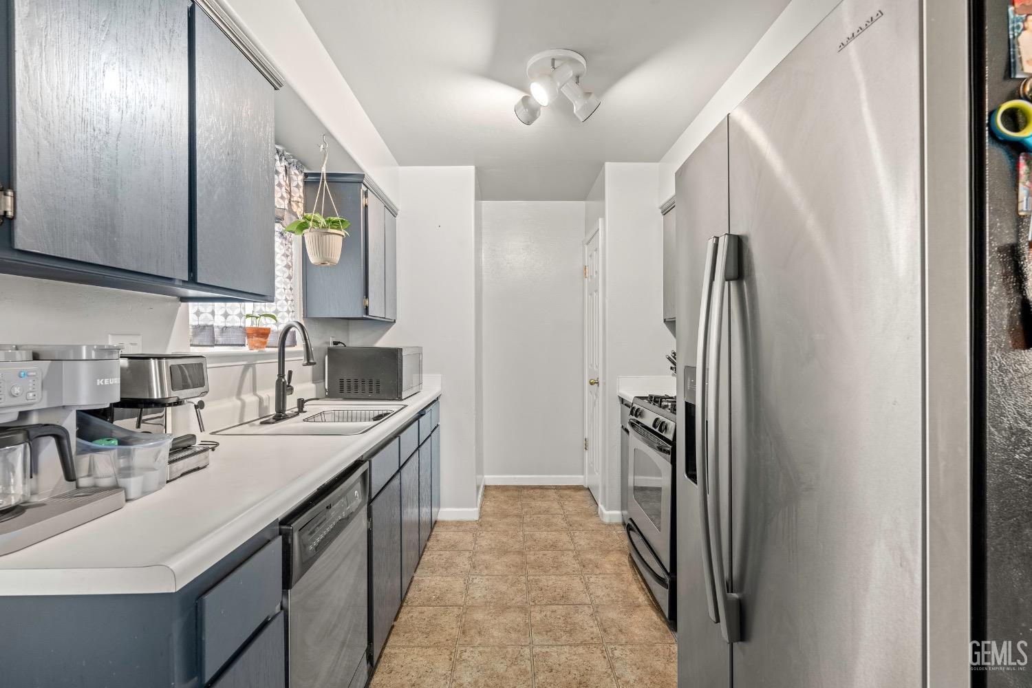 Undisclosed Address Arvin, CA 93203 - Photo 10 of 33 a kitchen with stainless steel appliances granite countertop a refrigerator and a sink
