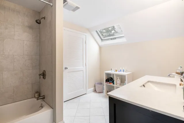 a bathroom with a sink a bathtub and a shower