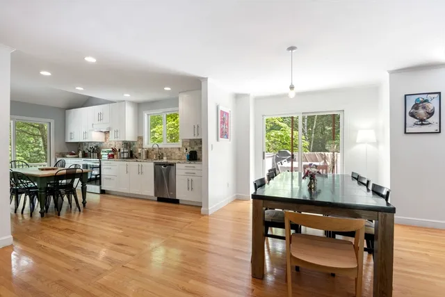 a kitchen with a table and chairs in it