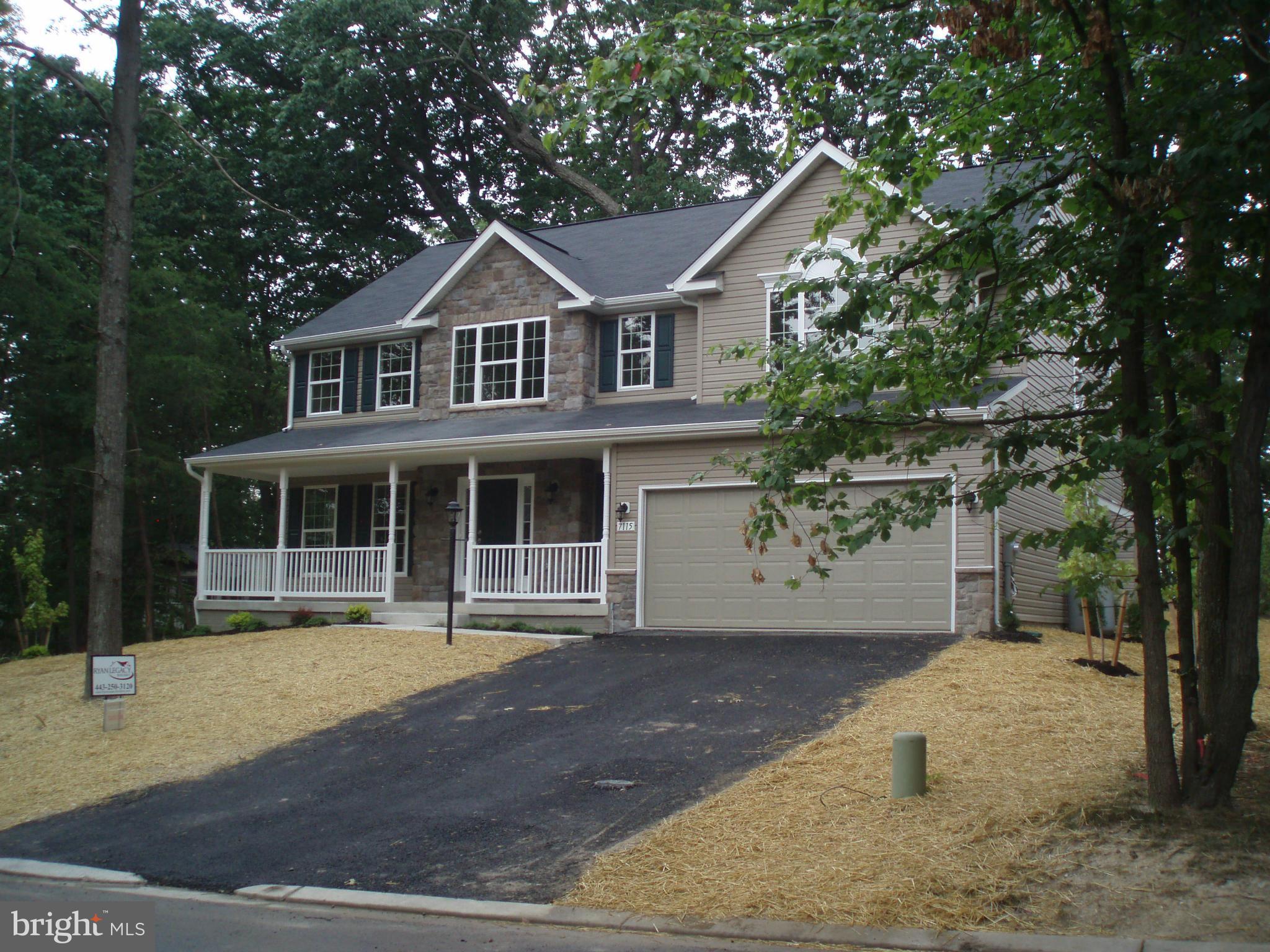 276 Ridgecrest Road New Market, MD 21774 - Photo 2 of 10 a front view of a house with a yard and garage