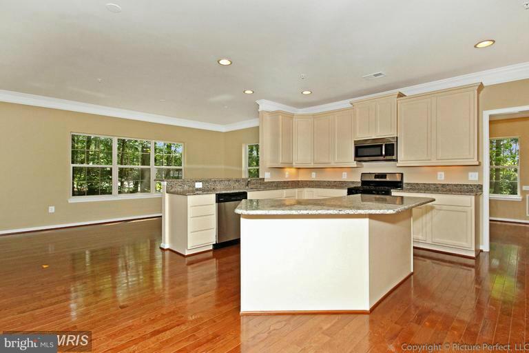 276 Ridgecrest Road New Market, MD 21774 - Photo 10 of 10 a kitchen with kitchen island granite countertop a stove top oven a sink a counter space and cabinets