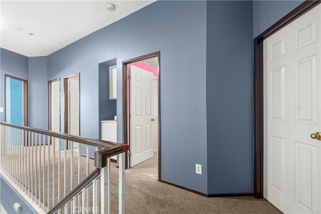 15417 Tobarra Road Fontana, CA 92337 - Photo 14 of 29 a view of a hallway with interior of the house