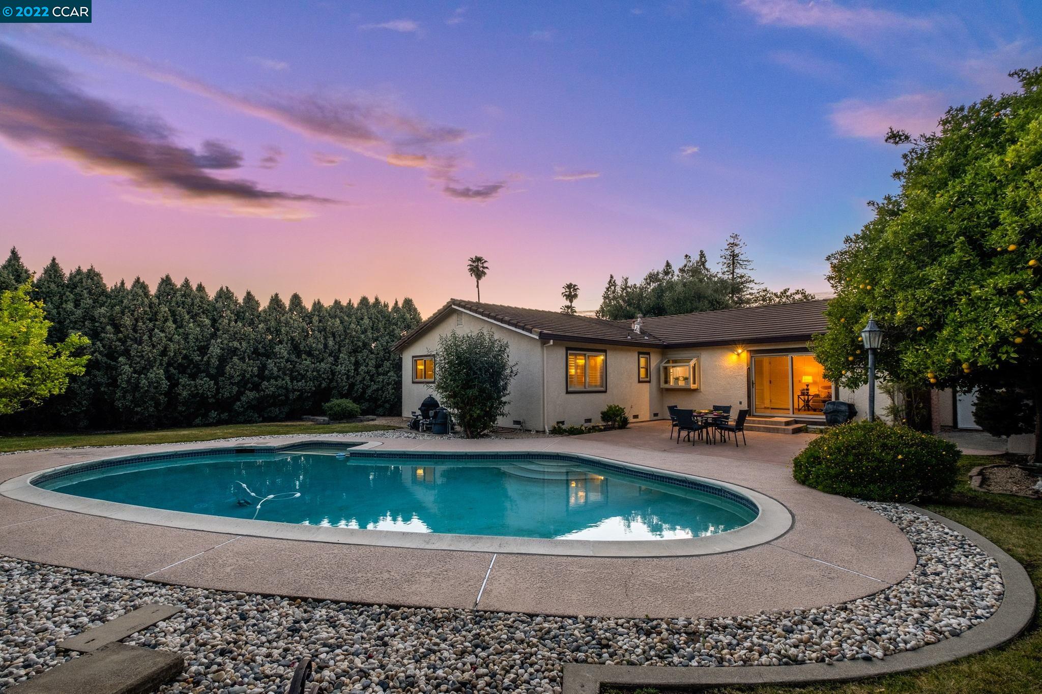 1 Carousel Court San Ramon, CA 94583 - Photo 1 of 1 a view of a swimming pool with a patio