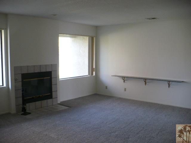 67360 Rango Road Cathedral City, CA 92234 - Photo 5 of 21 an empty room with a fireplace