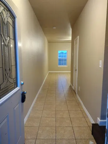 a view of hallway with a window