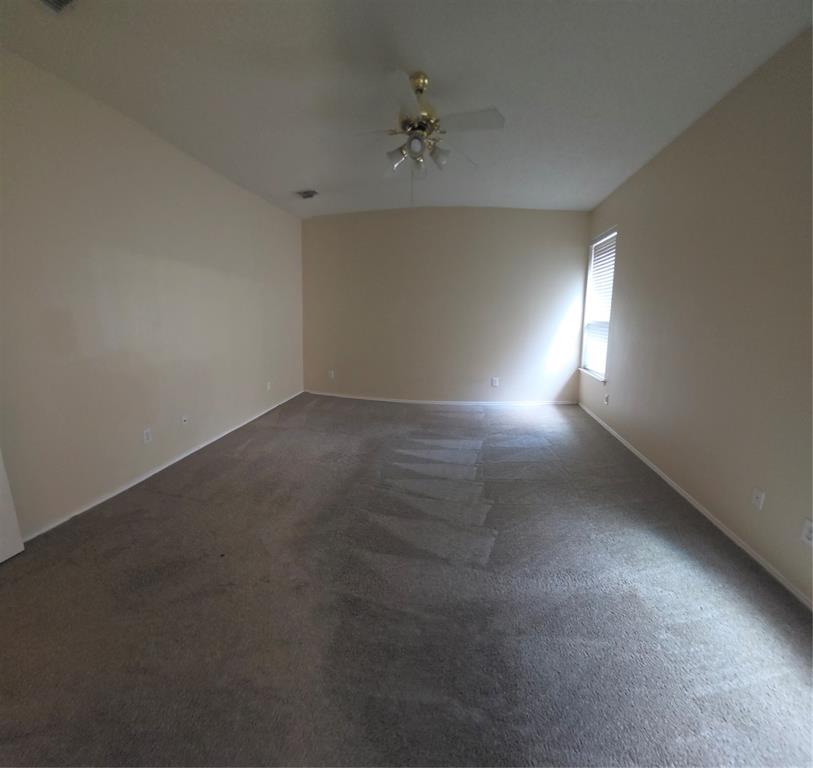 2820 Deer Ridge Drive Rockwall, TX 75032 - Photo 27 of 36 Wall-to-wall carpeting, neutral wall finishes, window with horizontal blinds, and a ceiling fan with integrated lighting
