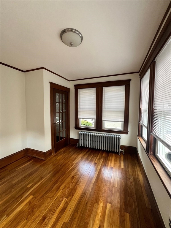 96 Brooks Street, Unit 1 Boston, MA 02135 - Photo 14 of 19 a view of livingroom with hardwood floor and window