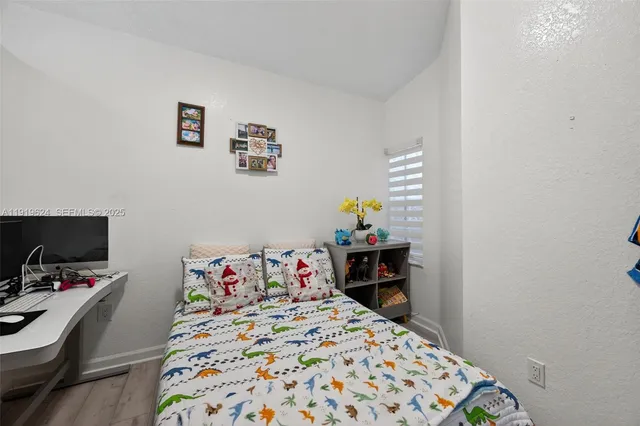 a bedroom with a bed and a tv in it