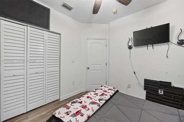 a view of a porch with furniture and floor to ceiling window