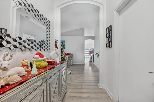 a hallway with toys and flower pot