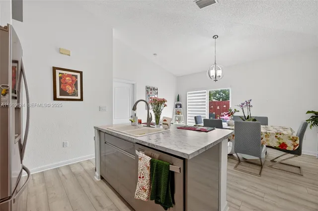 a view of a workspace with furniture and wooden floor