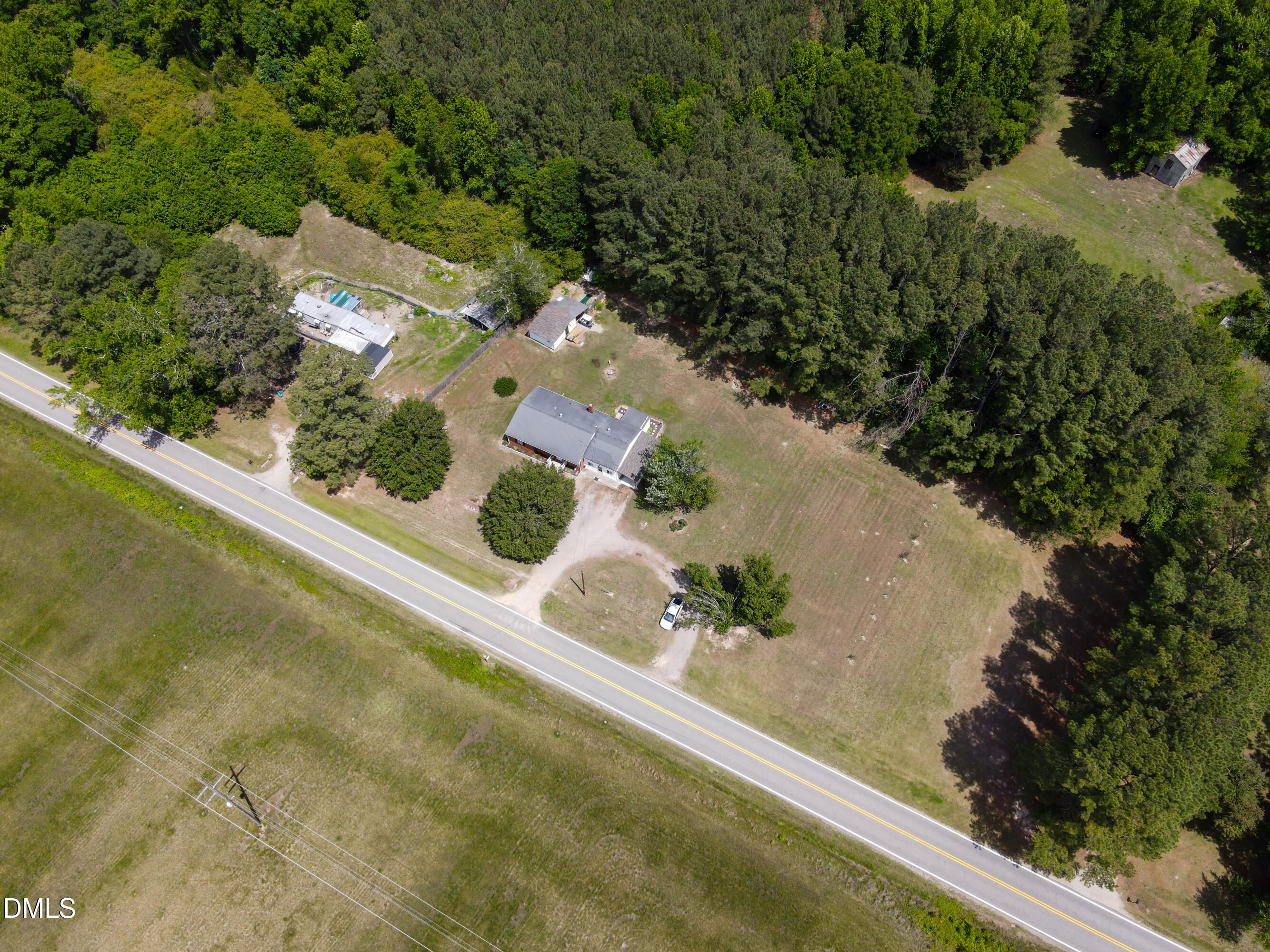 4967 Highway 581 Spring Hope, NC 27882 - Photo 37 of 44 an aerial view of a house with a yard and lake view