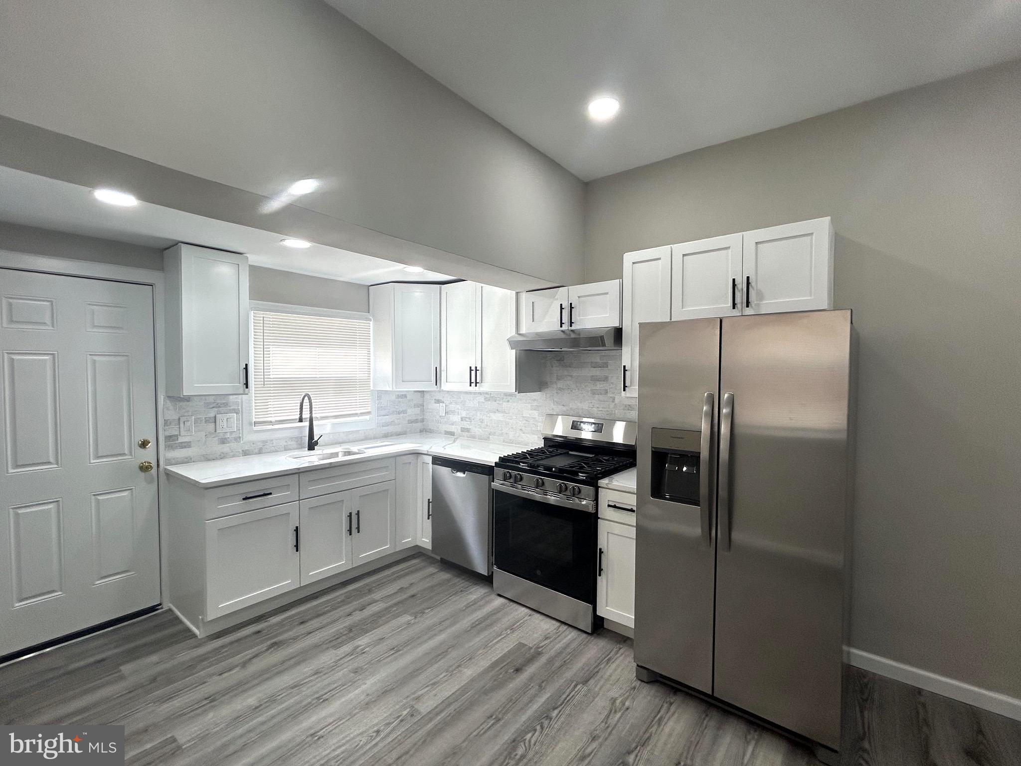 4303 Griscom Street Philadelphia, PA 19124 - Photo 11 of 43 Kitchen w/Back Door to Patio