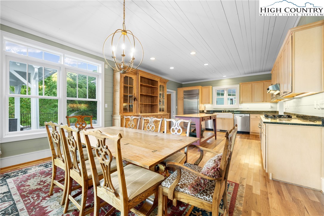 410-560 Puckett Road Banner Elk, NC 28604 - Photo 13 of 50 a view of a dining room with furniture window and outside view