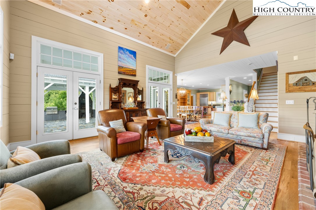 410-560 Puckett Road Banner Elk, NC 28604 - Photo 14 of 50 a living room with furniture a rug and a large window