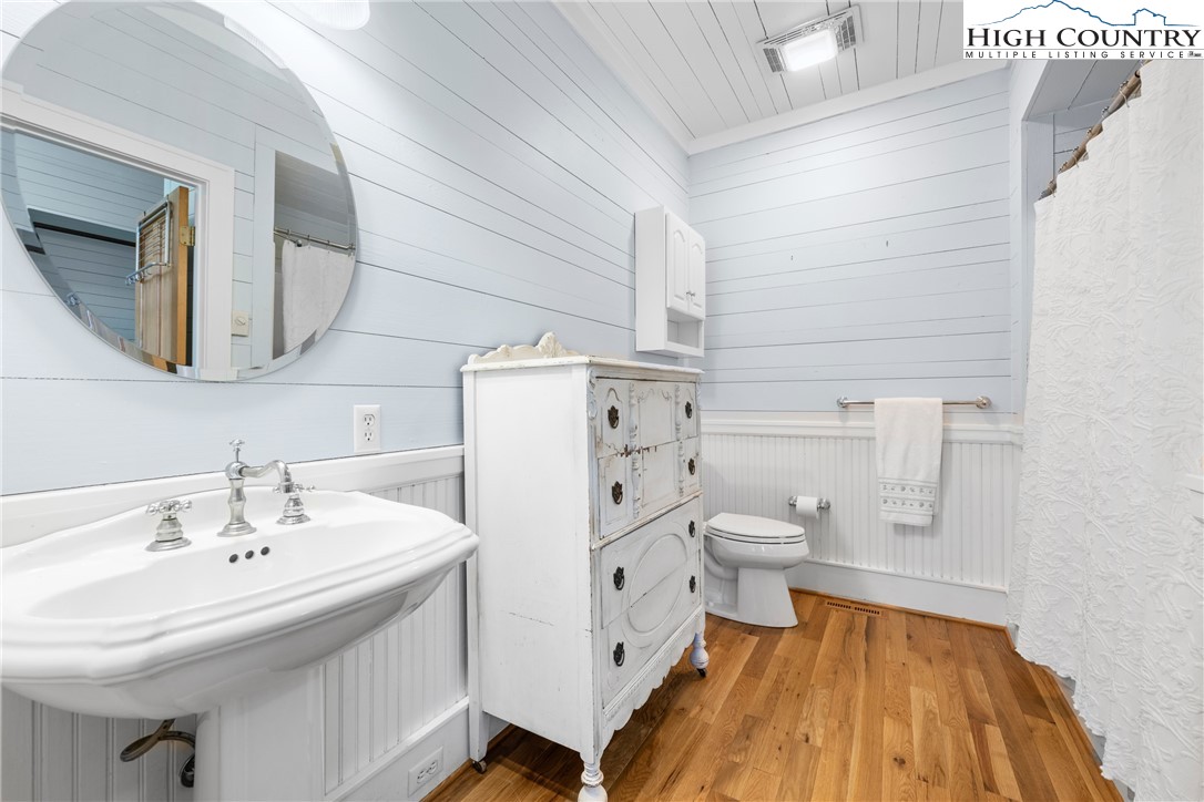 410-560 Puckett Road Banner Elk, NC 28604 - Photo 18 of 50 a bathroom with a sink a toilet and mirror