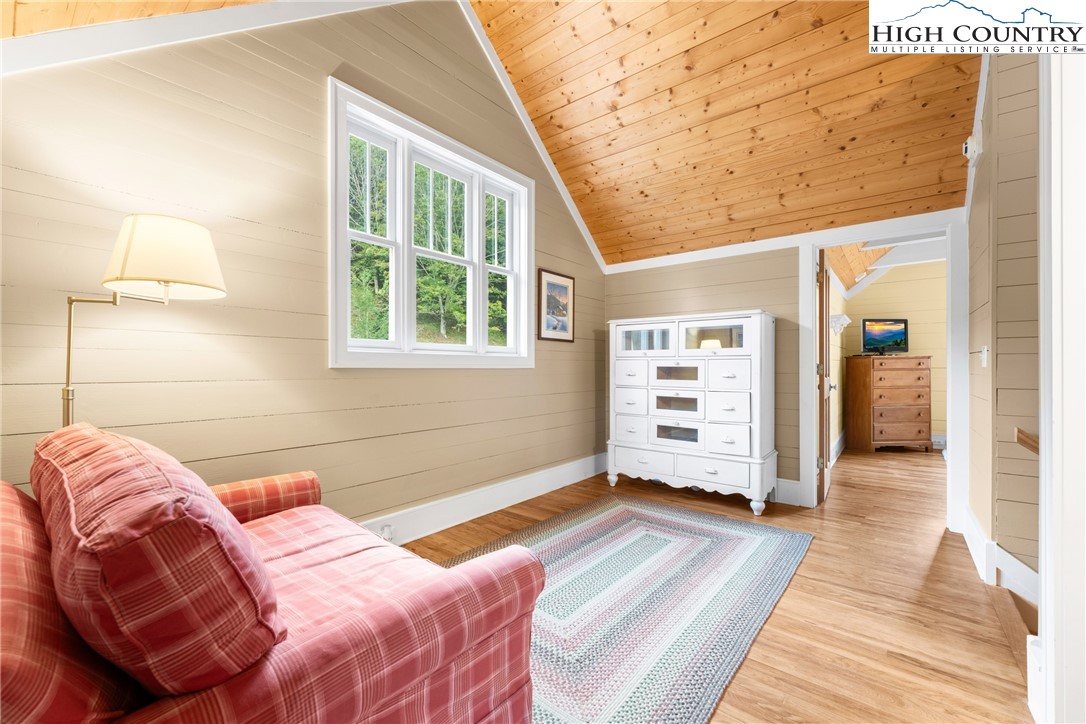 410-560 Puckett Road Banner Elk, NC 28604 - Photo 23 of 50 a bedroom with a bed and a window