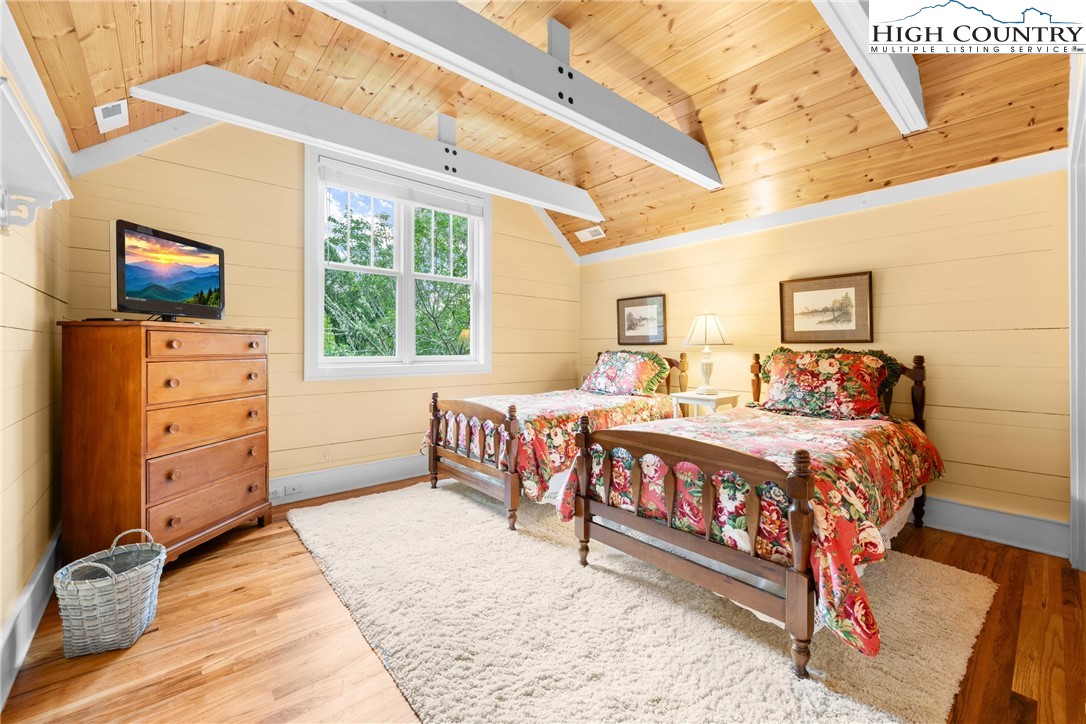 410-560 Puckett Road Banner Elk, NC 28604 - Photo 24 of 50 a bed room with a bed and a television