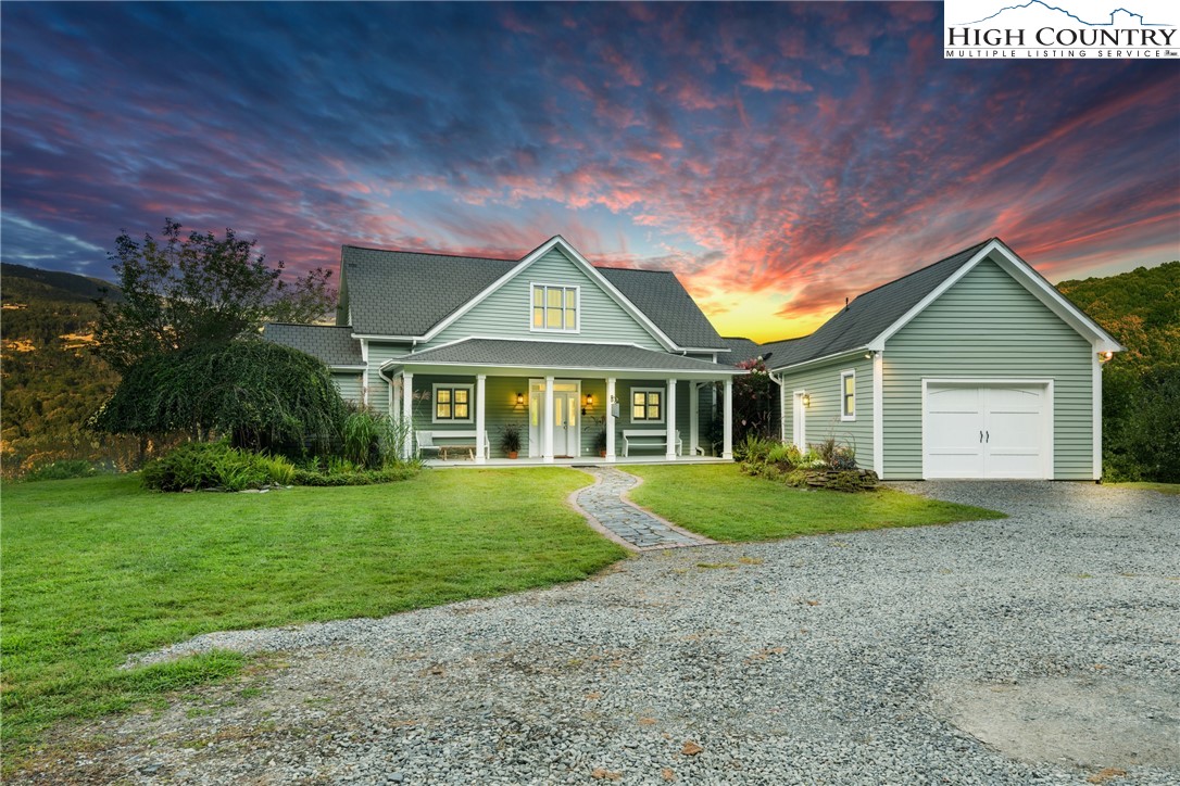 410-560 Puckett Road Banner Elk, NC 28604 - Photo 25 of 50 a front view of a house with a yard and garage