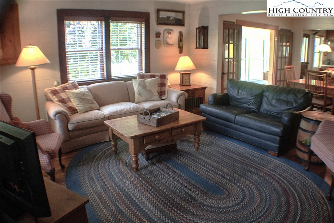 410-560 Puckett Road Banner Elk, NC 28604 - Photo 38 of 50 a living room with furniture and a large window