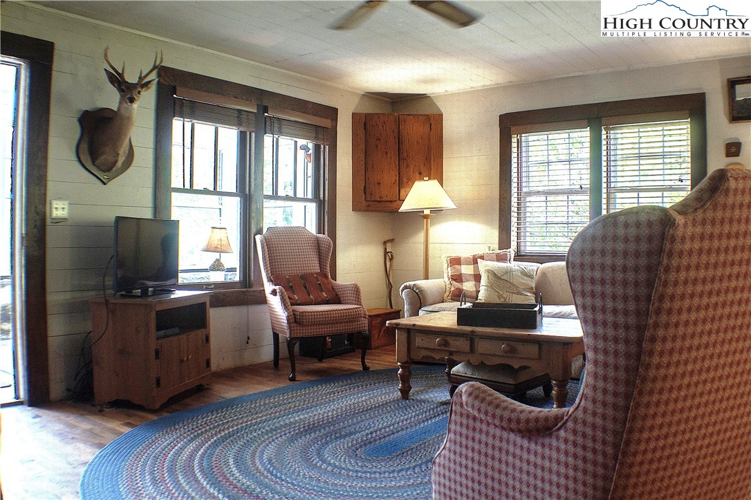 410-560 Puckett Road Banner Elk, NC 28604 - Photo 39 of 50 a living room with furniture and a flat screen tv