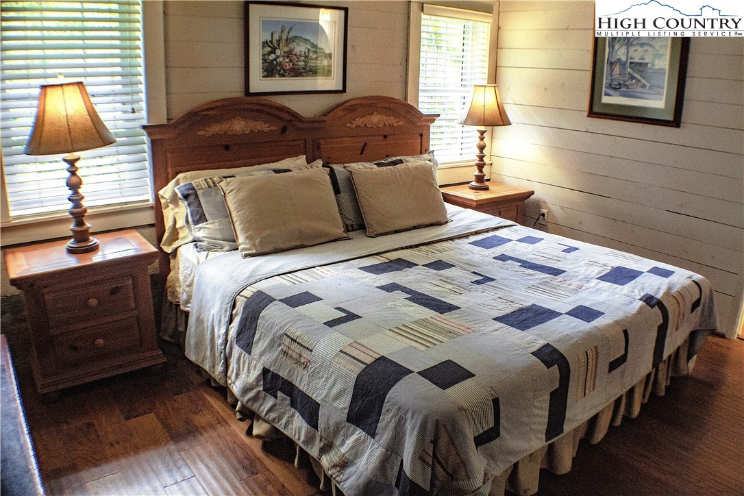 410-560 Puckett Road Banner Elk, NC 28604 - Photo 42 of 50 a bedroom with a bed and a window