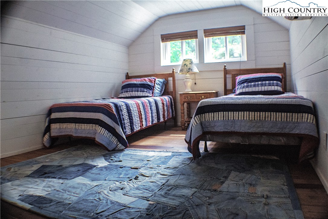 410-560 Puckett Road Banner Elk, NC 28604 - Photo 43 of 50 a bedroom with a bed and window
