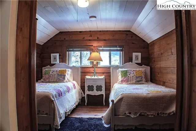 a bedroom with a bed and a balcony