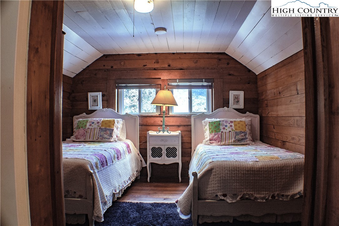 410-560 Puckett Road Banner Elk, NC 28604 - Photo 44 of 50 a bedroom with a bed and a balcony