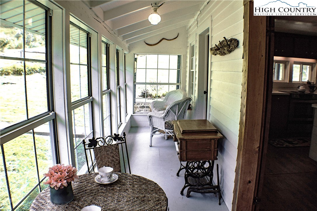 410-560 Puckett Road Banner Elk, NC 28604 - Photo 45 of 50 a living room with furniture and a floor to ceiling window