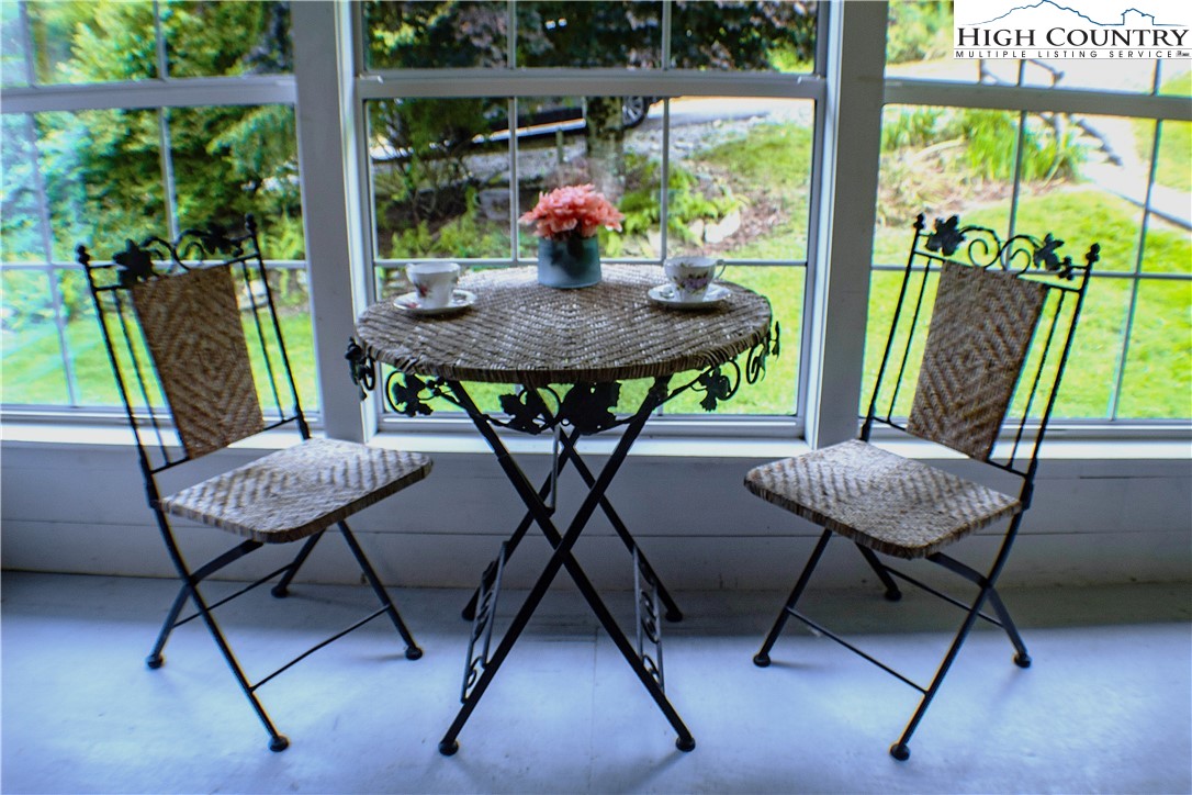 410-560 Puckett Road Banner Elk, NC 28604 - Photo 47 of 50 a view of a dining room with furniture window and outside view