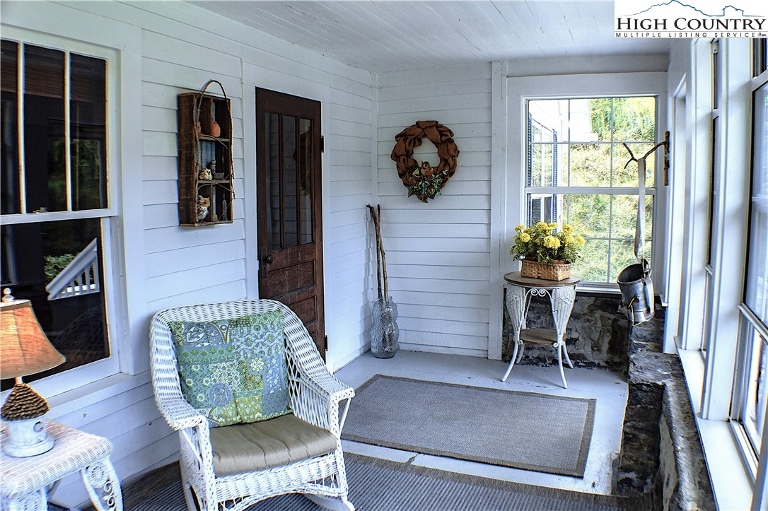 410-560 Puckett Road Banner Elk, NC 28604 - Photo 49 of 50 a living room with furniture and a window