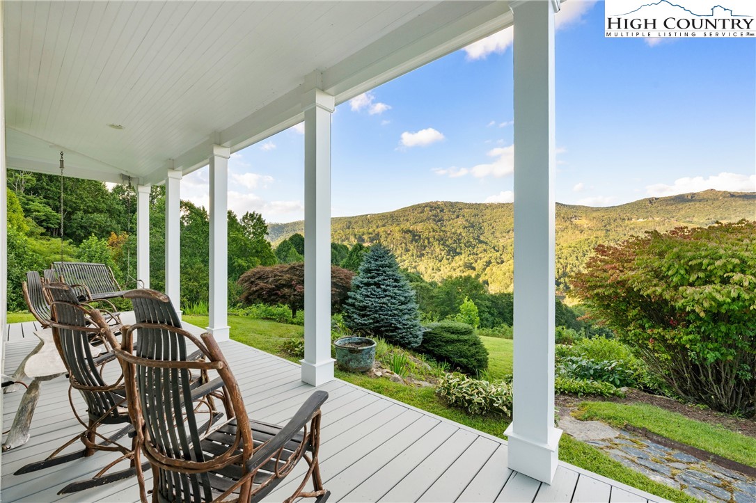 410-560 Puckett Road Banner Elk, NC 28604 - Photo 8 of 50 a view of a city from a balcony with furniture and garden