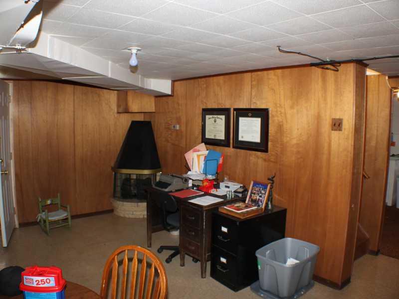 1010 Connor Road Mt. Lebanon, PA 15234 - Photo 12 of 24 Family Room. Enjoy spending time in the 28X12 L-shaped paneled family room/ game room which is located in the basement of the house. It features an electric fireplace, tile flooring and built-in shelving.