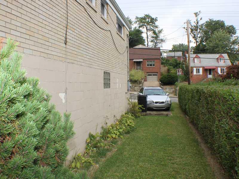 1010 Connor Road Mt. Lebanon, PA 15234 - Photo 24 of 24 Land/Lot. The side access to the back yard and patio is convenient to the driveway and garage.