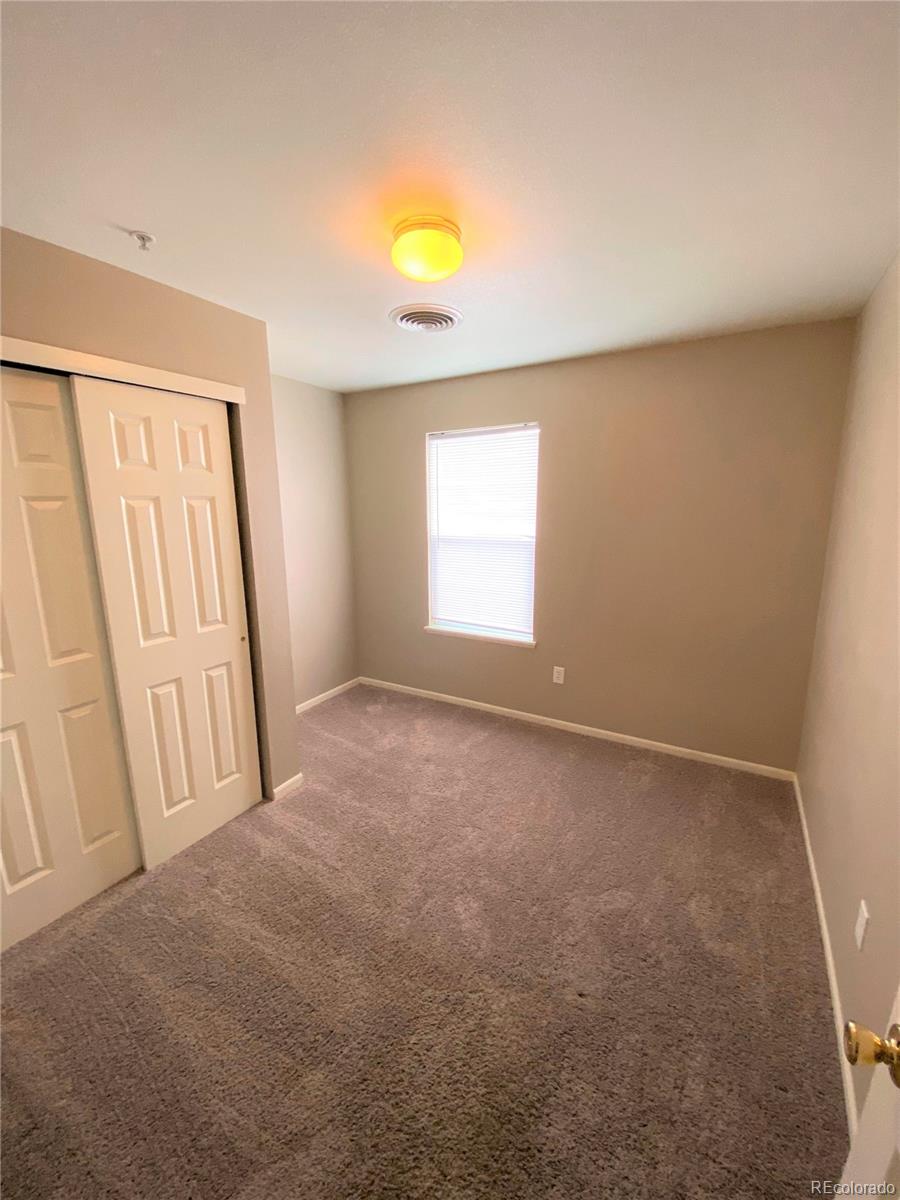 2226 West Elizabeth Street, Unit 202 Fort Collins, CO 80521 - Photo 7 of 9 a view of an empty room with a window