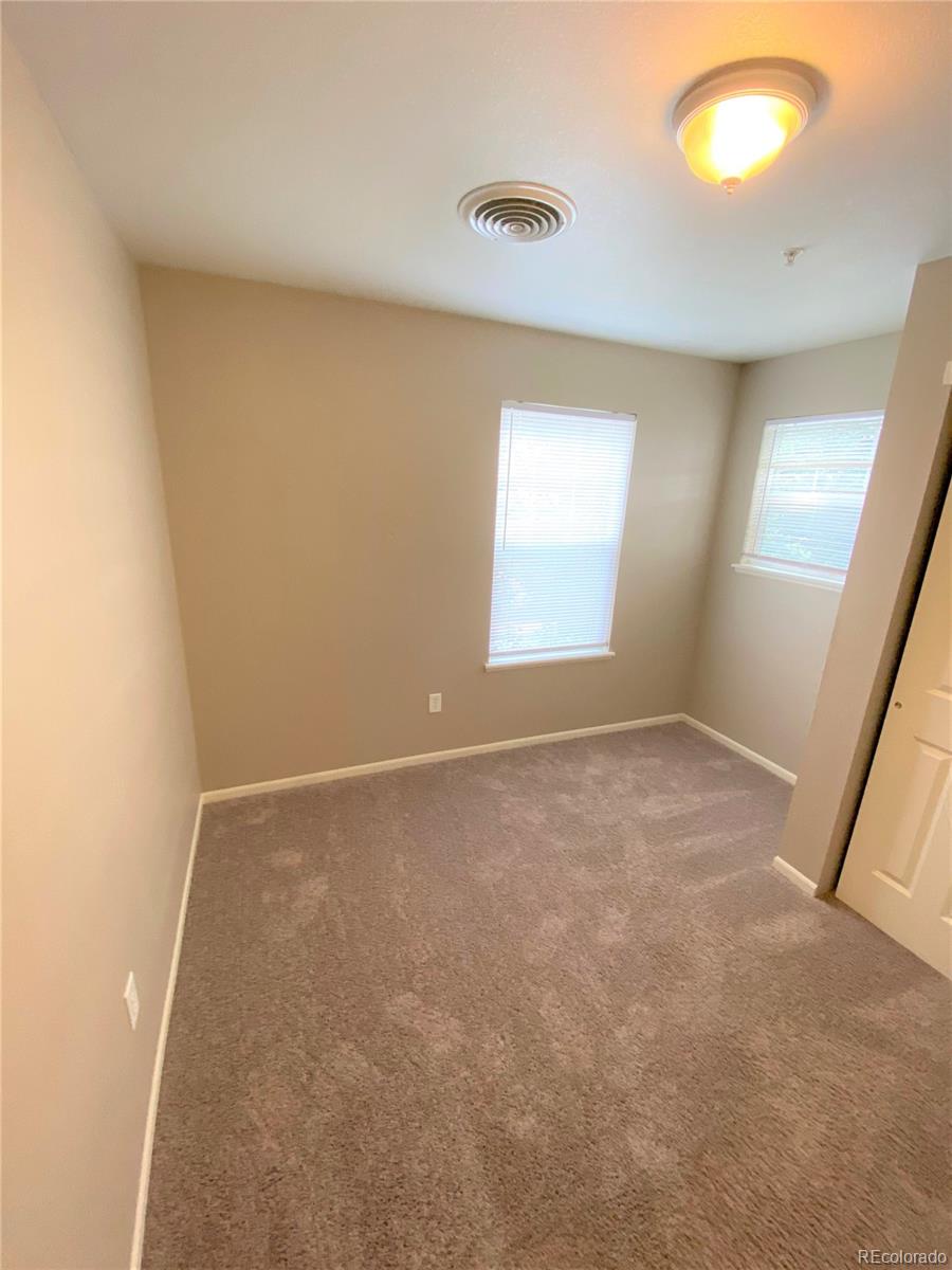 2226 West Elizabeth Street, Unit 202 Fort Collins, CO 80521 - Photo 8 of 9 an empty room with a window