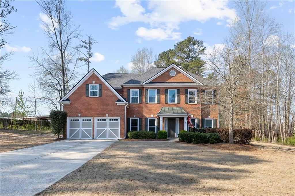 2835 Maple Springs Court Marietta, GA 30064 - Photo 1 of 1 a front view of a house with a yard